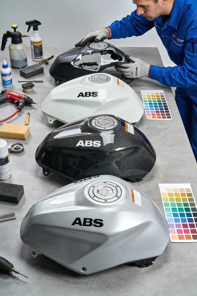 Row of repaired motorcycle fairings in a clean, well-organized shop environment.