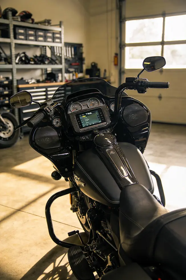 Showroom scene with Hoppe fairings on a Harley Softail, emphasizing design, tech integration, and market appeal.