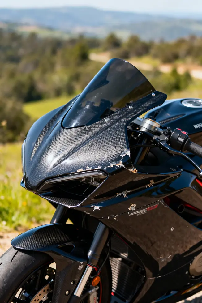 A motorcycle with pristine fairings in a beautiful outdoor location.